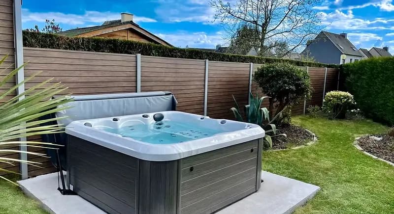 Hot tub installed in backyard garden