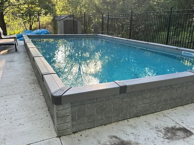 Mini pool in backyard with fence