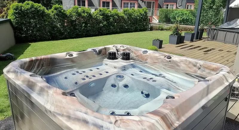 Marble finish hot tub on lawn