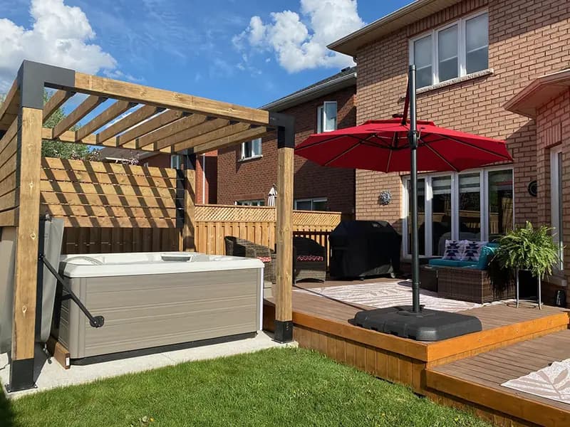 Hot tub under pergola on deck