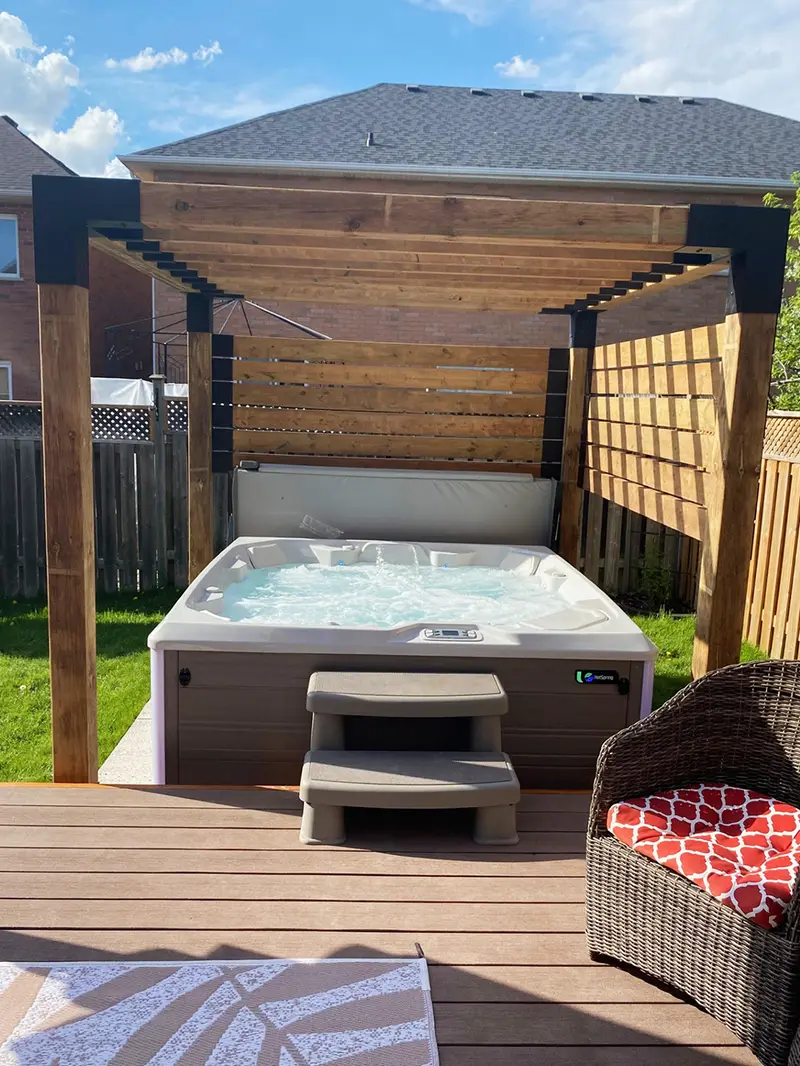 Hot tub under covered pergola