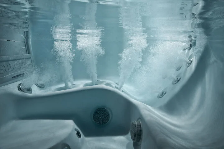 Underwater view of Volcano jets running in a Maple Spa lounge seat