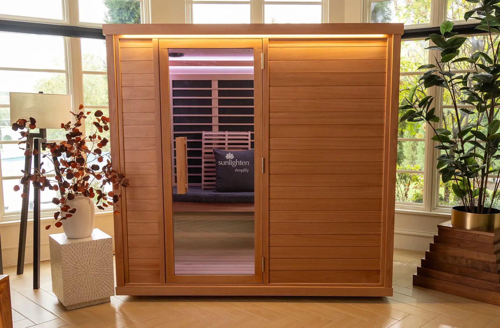 Sunlighten Amplify full-spectrum infrared sauna in a sunlit living room